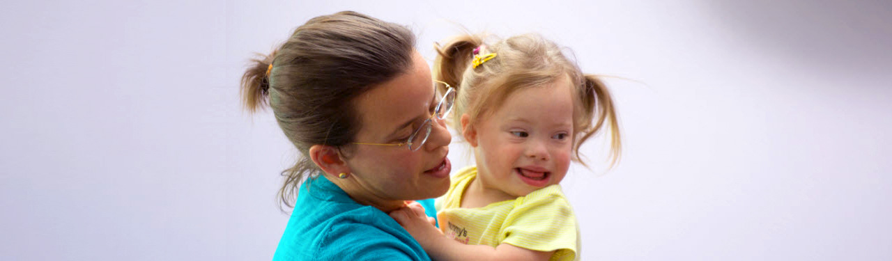 Mother Holding Child with Special Needs