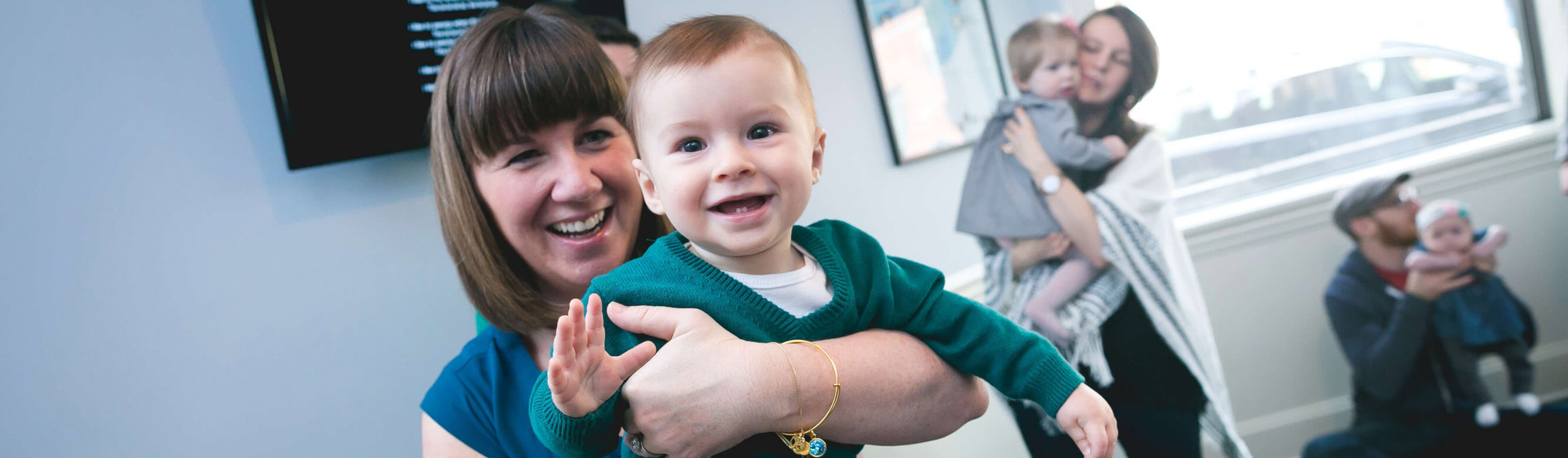 Photo-Kindermusik-Classroom-mom-son-holding-smiling-happy-4800x3200-e1471549331271